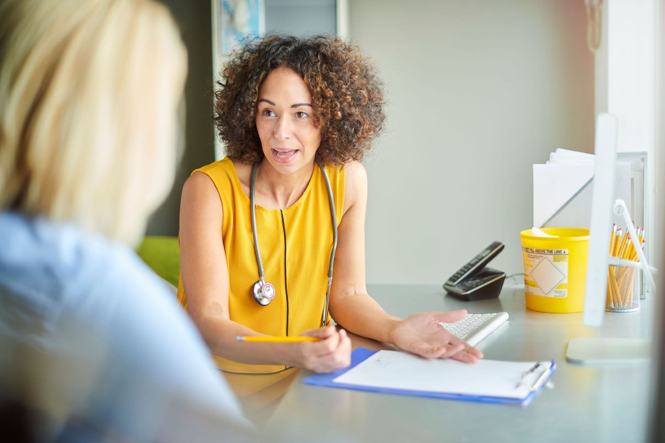 GP consulting a patient