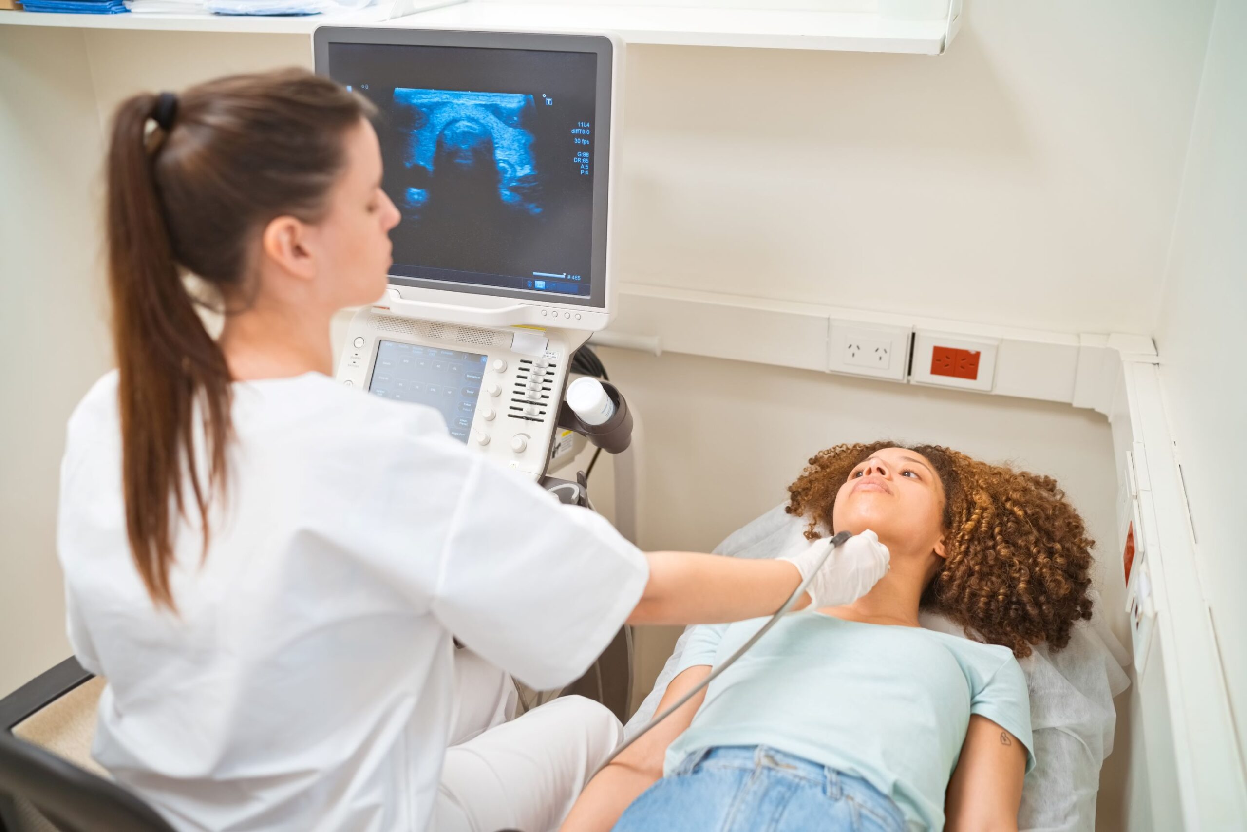 A picture of a patient and health professional during ultrasound scan